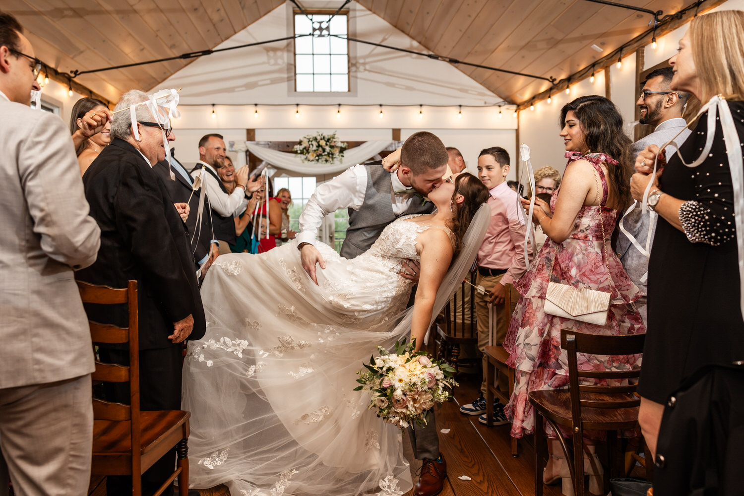 groom dipping bride